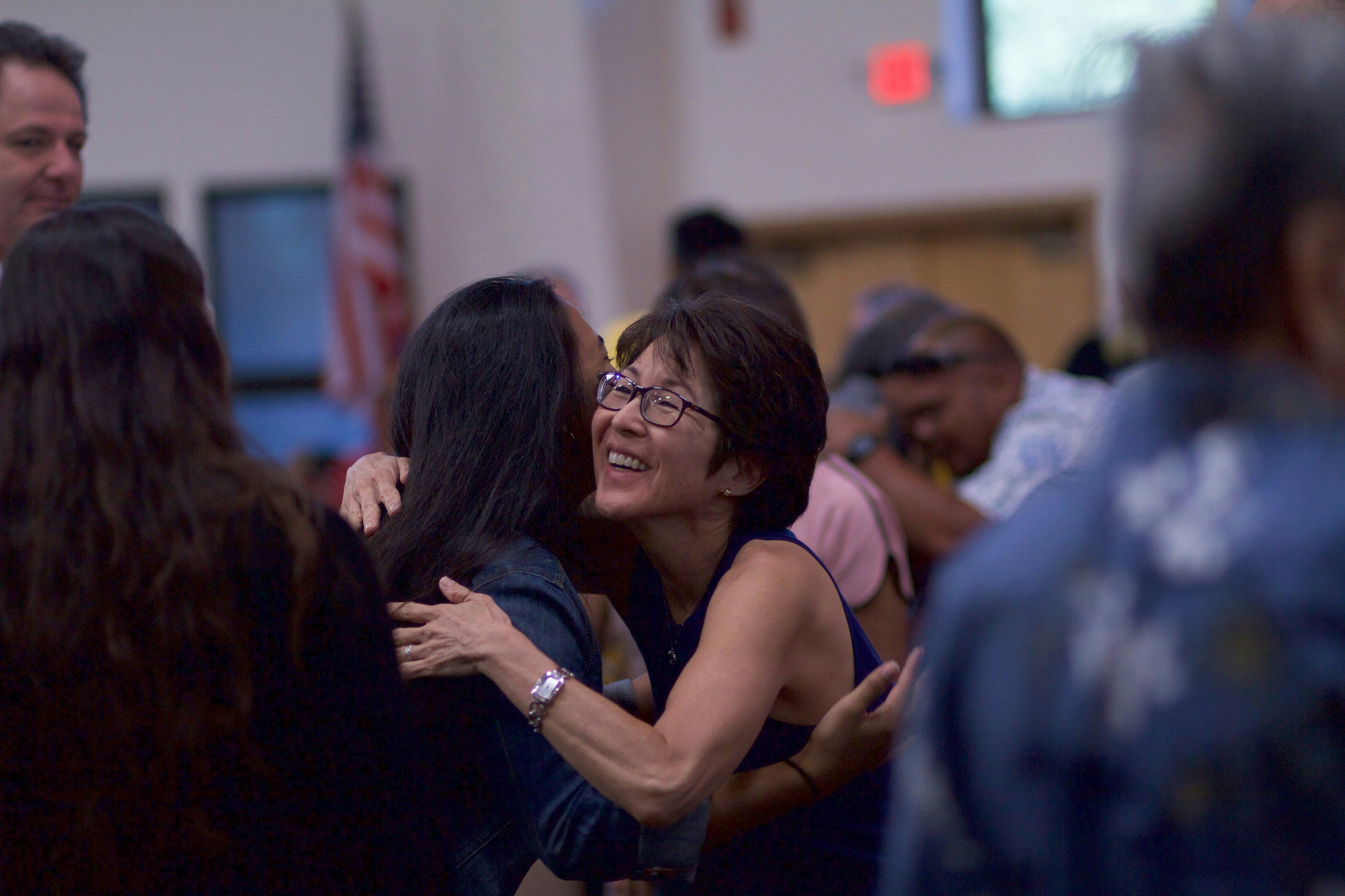 Church members warmly welcoming one another