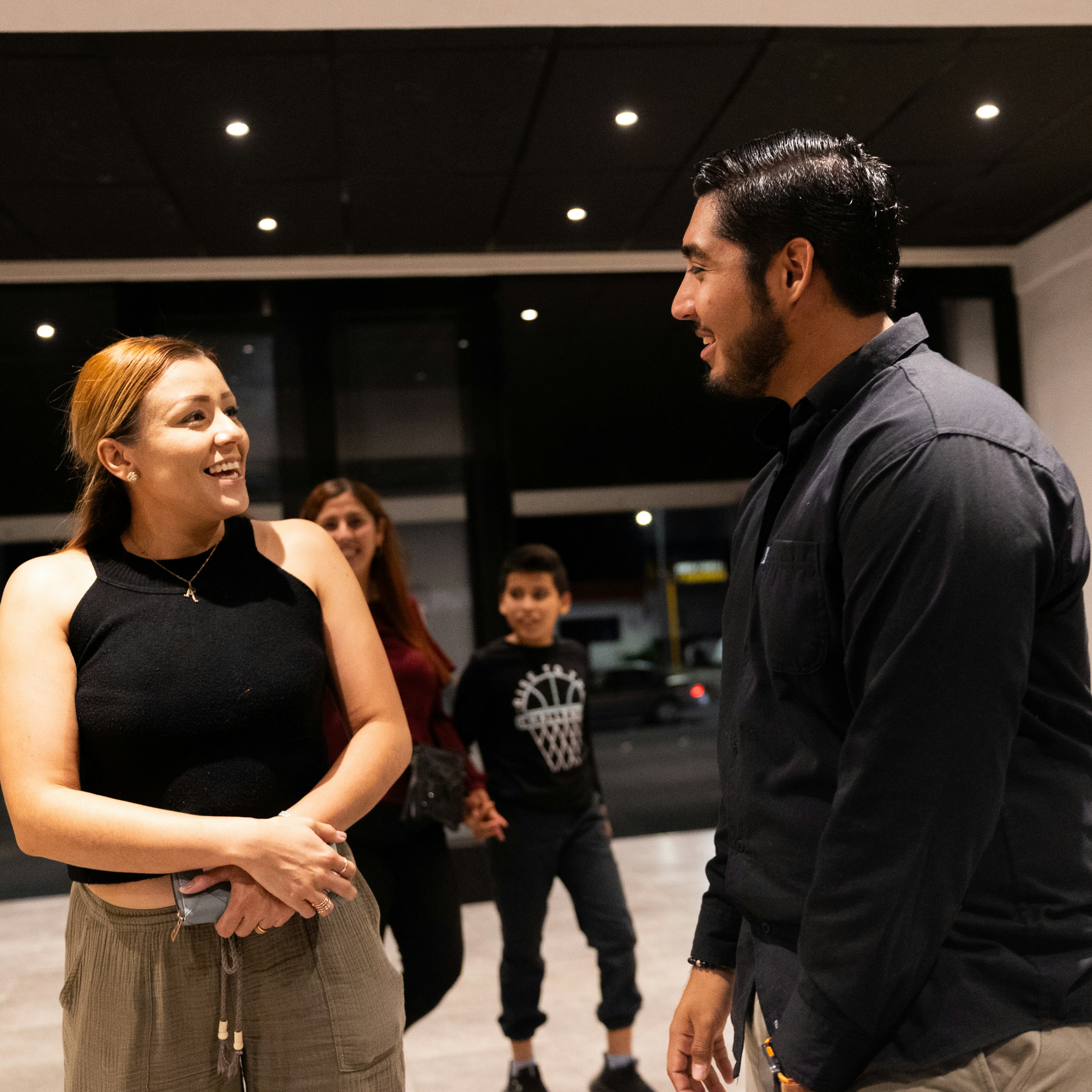 Church visitors sharing a welcoming conversation